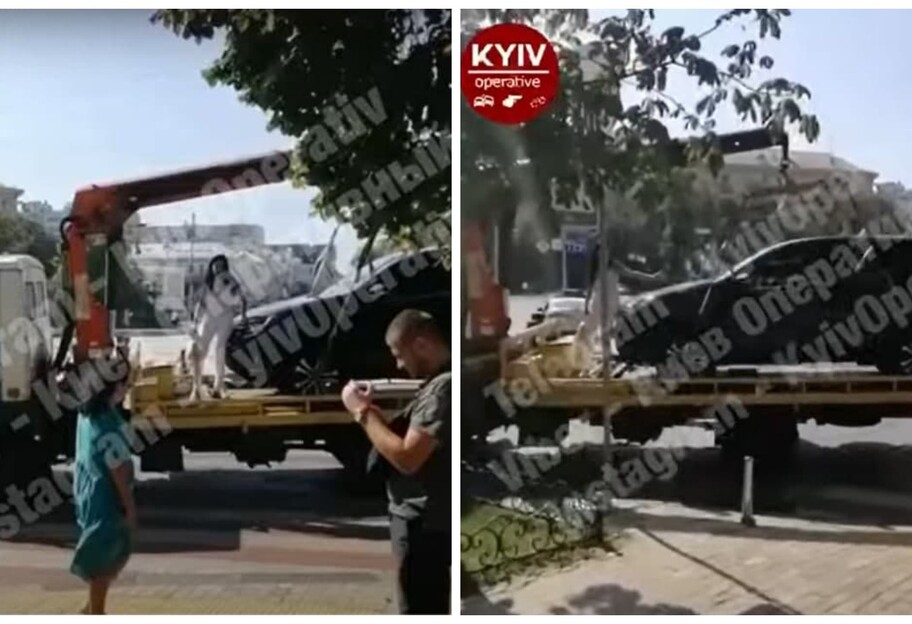 Эвакуатор в Киеве забирал авто, на него залезла женщина - видео - фото 1